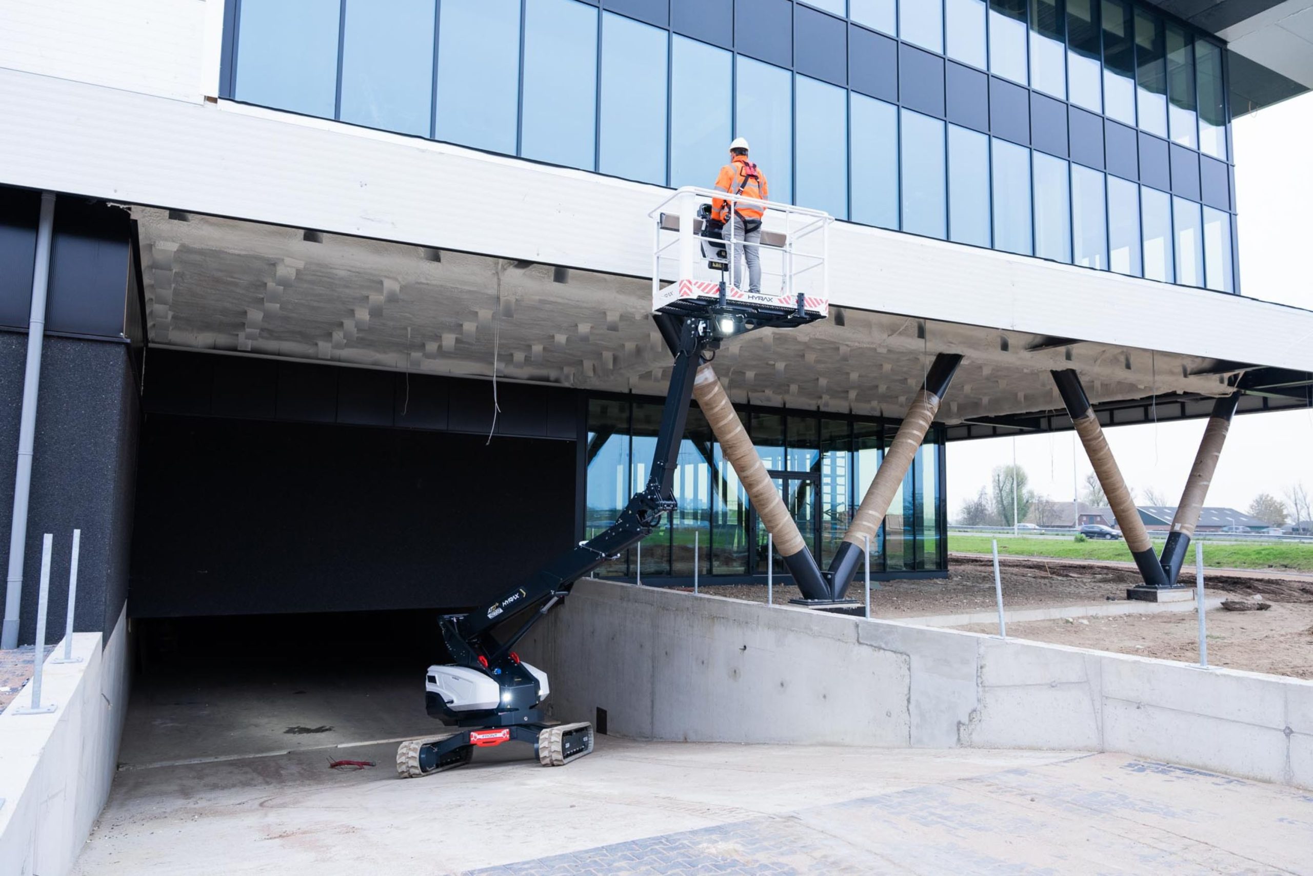 HYRAX telescopic boom lift on rough terrain at an angle